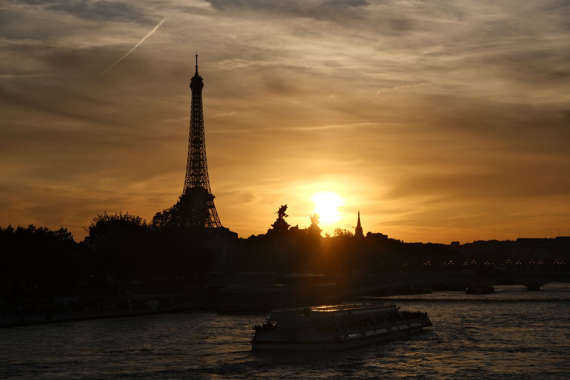 The Eiffel Tower and the Seine at sunset in Paris, Air France's home city